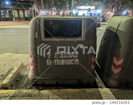 El Calafate, Patagonia, Argentina - March 8, 2026: Food waste recycling container on a city street 140216261