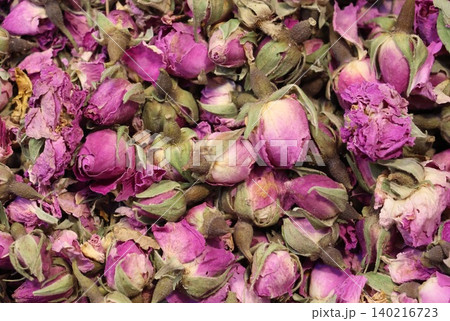 Close-up background of dried pink rosebuds and petals, captured in detailed macro view, showcasing natural textures, vibrant floral colors, and botanical beauty for wellness themes. Close-up background of dried pink rosebuds and petals, captured in detailed macro view, showcasing natural textures, vibrant floral colors, and botanical beauty for wellness themes. 140216723
