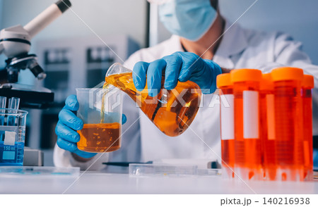 Lab technician experimenting in lab Lab technician experimenting in lab 140216938