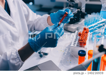 Lab technician experimenting in lab Lab technician experimenting in lab 140216939
