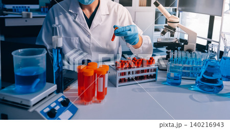 Lab technician experimenting in lab Lab technician experimenting in lab 140216943