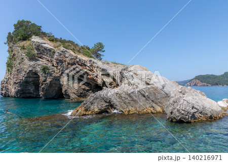 Rocky coast and turquoise Adriatic water at Sveti Nikola Island near Budva Rocky coast and turquoise Adriatic water at Sveti Nikola Island near Budva 140216971