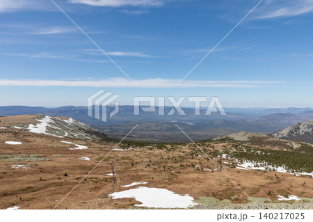 Wide mountain tundra landscape with melting snow in Iremel Nature Park, Russia Wide mountain tundra landscape with melting snow in Iremel Nature Park, Russia 140217025