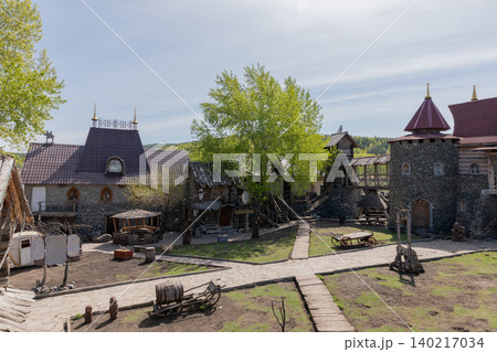 Sonkina Laguna park courtyard with medieval style buildings in Satka, Russia Sonkina Laguna park courtyard with medieval style buildings in Satka, Russia 140217034