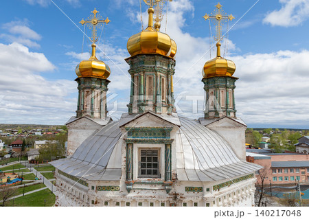 Golden domes of Orthodox church in Nevyansk town under blue sky, Russia 140217048