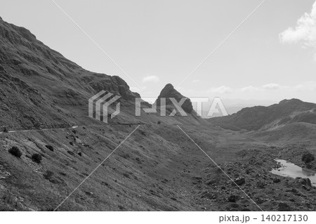 Mountain road and rocky peak landscape in Durmitor National Park, Montenegro Mountain road and rocky peak landscape in Durmitor National Park, Montenegro 140217130