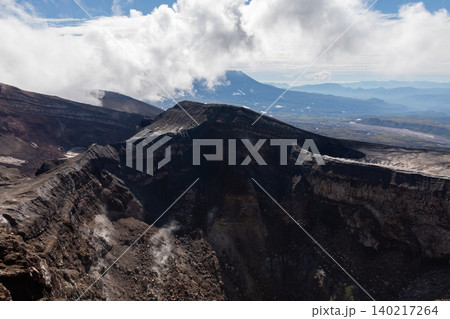 Gorely Volcano crater landscape with steam and clouds, Kamchatka Peninsula 140217264