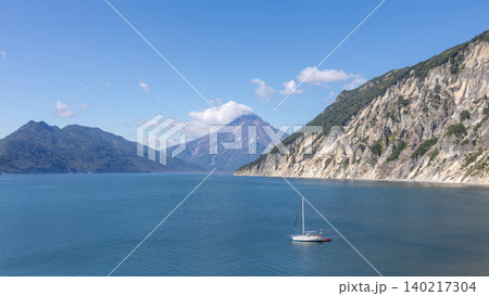 Sailboat in Vilyuchinskaya Bay with Vilyuchinsky Volcano, Kamcha 140217304
