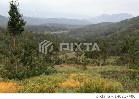 Vachkazhets mountain range landscape with forested hills and river valley Vachkazhets mountain range landscape with forested hills and river valley 140217400