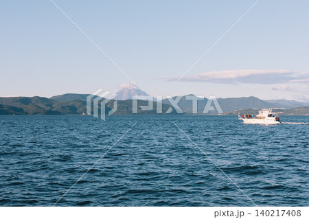 Tourist boat on Avacha Bay with volcano landscape, Kamchatka, Russia Tourist boat on Avacha Bay with volcano landscape, Kamchatka, Russia 140217408
