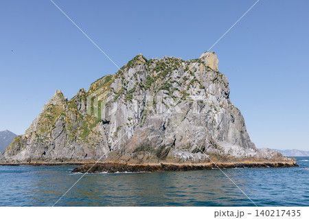 Rocky sea stack island in Avacha Bay near Petropavlovsk-Kamchatsky, Kamchatka 140217435