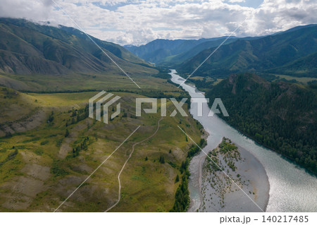 Aerial view of Ak-Kem valley river winding through Altai mountains landscape Aerial view of Ak-Kem valley river winding through Altai mountains landscape 140217485