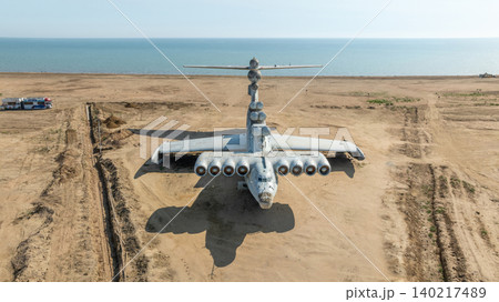 Abandoned Soviet ekranoplan on Caspian Sea coast near Arablyar, aerial view 140217489