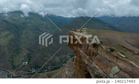 Dramatic cliff edge viewpoint above mountain valley near Goor village, Dagestan 140217493