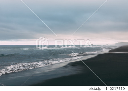 Stormy seascape with black volcanic sand shoreline at Khalaktyrsky Beach Stormy seascape with black volcanic sand shoreline at Khalaktyrsky Beach 140217510