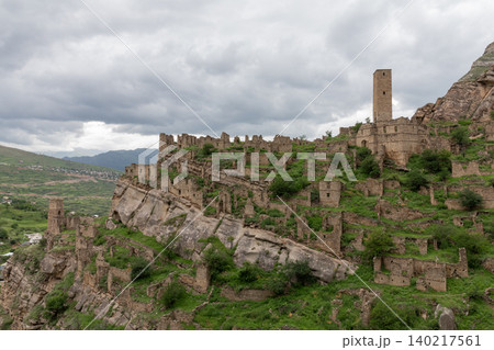 Ancient stone ruins and defensive tower in Kahib mountain village, Dagestan 140217561