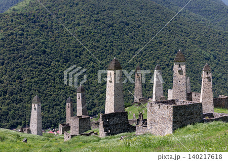 Erzi tower complex stone watchtowers on a green mountain slope in Ingushetia 140217618