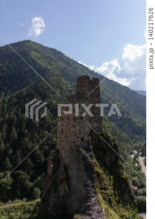 Vovnushki tower complex on rocky cliff in Ingushetia mountain landscape, Russia 140217626