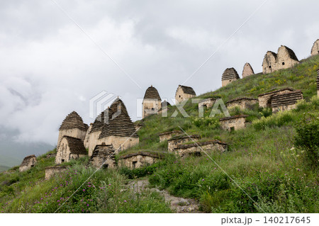 Dargavs City of the Dead necropolis stone crypts on a mountain hillside Dargavs City of the Dead necropolis stone crypts on a mountain hillside 140217645
