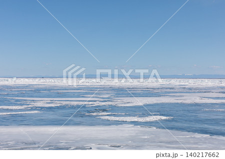 Winter ice and open water on Lake Baikal under clear blue sky panorama Winter ice and open water on Lake Baikal under clear blue sky panorama 140217662