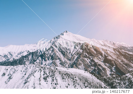 Snowy Peak Galina mountain landscape near Arshan village in winter sunlight 140217677