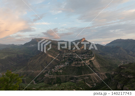 Panoramic view of Gunib village on mountain plateau at sunset, Dagestan Panoramic view of Gunib village on mountain plateau at sunset, Dagestan 140217743