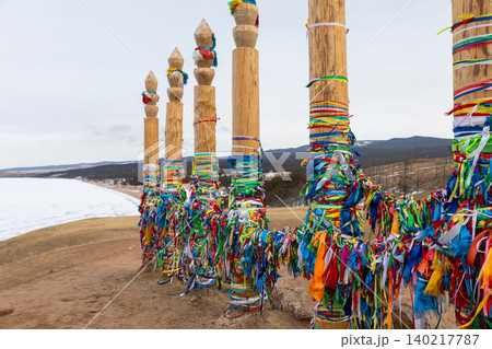 Colorful shaman ritual poles with ribbons on Olkhon Island, Lake Baikal shore 140217787