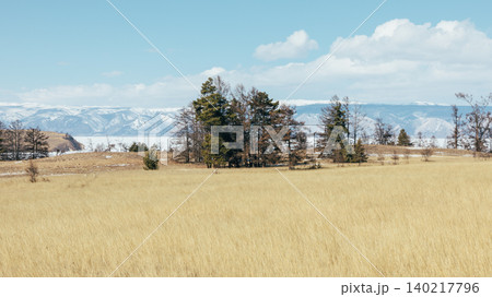 Spring steppe landscape at Cape Kharantsy on Lake Baikal with mountains Spring steppe landscape at Cape Kharantsy on Lake Baikal with mountains 140217796