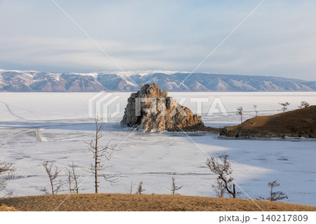 Shaman Rock on frozen Lake Baikal near Khuzhir village, Olkhon Island Shaman Rock on frozen Lake Baikal near Khuzhir village, Olkhon Island 140217809