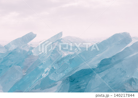Turquoise ice hummocks on frozen Lake Baikal shoreline in winter daylight 140217844