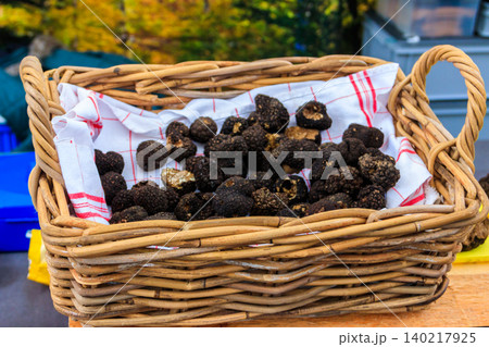 Expensive black truffles gourmet mushrooms in basket 140217925