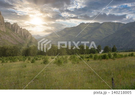 Summer sunrise over green valley and mountains in Altai Republic landscape Summer sunrise over green valley and mountains in Altai Republic landscape 140218005