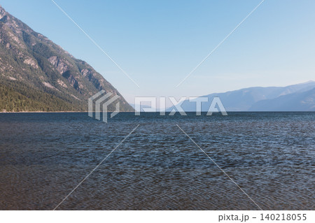 Calm waters and mountain shoreline on Lake Teletskoye, Altai landscape view 140218055
