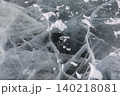 Frozen Lake Baikal ice texture with cracks, bubbles and snow, winter background 140218081