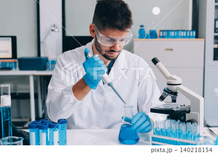 Lab technician experimenting in lab Lab technician experimenting in lab 140218154