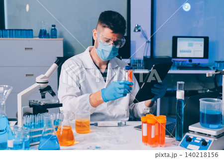 Lab technician experimenting in lab Lab technician experimenting in lab 140218156