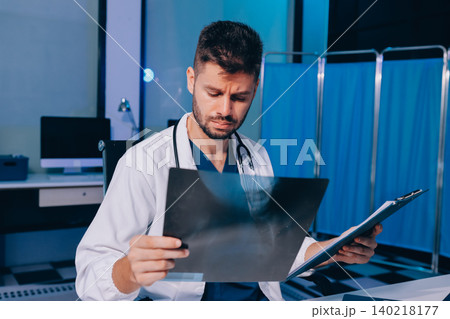Man, doctor and laptop typing in healthcare research, communication or social media at office desk. Male medical expert working on computer in online search, browsing or chatting on tablet at clinic Man, doctor and laptop typing in healthcare research, communication or social media at office desk. Male medical expert working on computer in online search, browsing or chatting on tablet at clinic 140218177