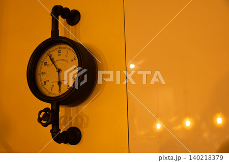 Vintage Industrial Wall Clock Mounted on Pipe Fittings Vintage Industrial Wall Clock Mounted on Pipe Fittings 140218379