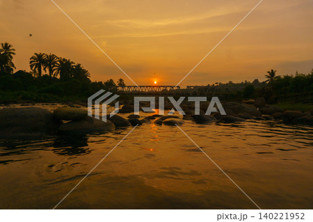 Beautiful morning view in Indonesia, panoramic landscape of rice fields with mountain ranges and clear sky Beautiful morning view in Indonesia, panoramic landscape of rice fields with mountain ranges and clear sky 140221952