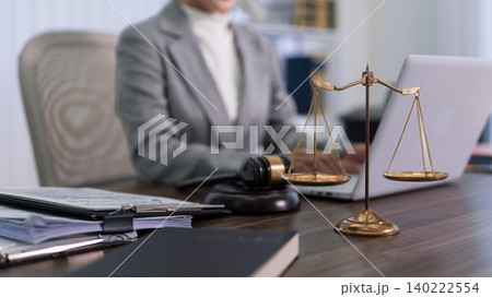 professional lawyer attorney working with laptop computer and justice scales gavel at modern office desk legal consultation services concept business workplace professional lawyer attorney working with laptop computer and justice scales gavel at modern office desk legal consultation services concept business workplace 140222554