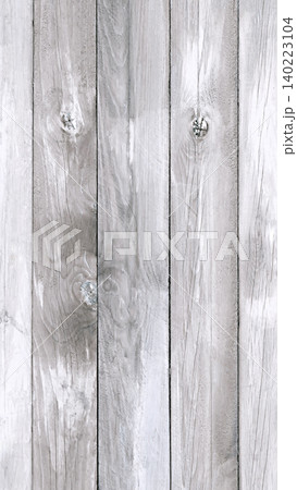 Vertical weathered gray wooden fence planks with visible grain and knots aspect ratio 9 16 140223104