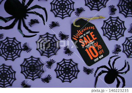 Happy Halloween Sale 10% Off with Price Tag and Halloween elements decorated on purple background Happy Halloween Sale 10% Off with Price Tag and Halloween elements decorated on purple background 140223235