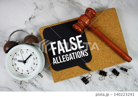 False Allegations text on speech bubble with alarm clock and wooden gavel on marble background False Allegations text on speech bubble with alarm clock and wooden gavel on marble background 140223291