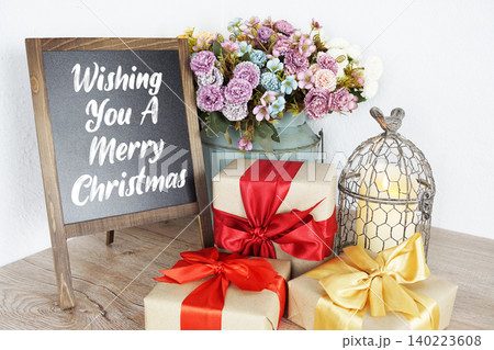 Wishing You A Merry Christmas message written on easel blackboard Wishing You A Merry Christmas message written on easel blackboard 140223608
