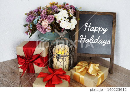 Happy Holidays message written on easel blackboard Happy Holidays message written on easel blackboard 140223612