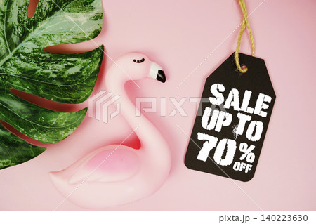 Price tag Sale 70% with summer decorations on pink background 140223630