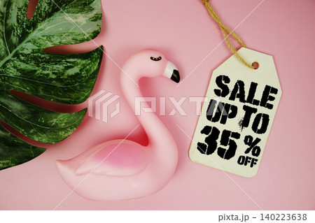 Price tag Sale 35% with summer decorations on pink background 140223638