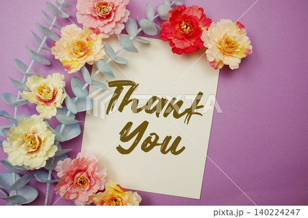 Thank You text written on paper card with flowers decoration 140224247