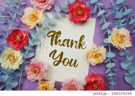 Thank You text written on paper card with flowers decoration Thank You text written on paper card with flowers decoration 140224249