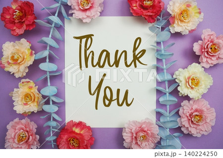 Thank You text written on paper card with flowers decoration 140224250